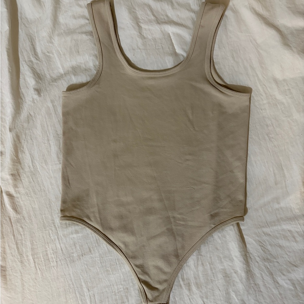 Woman’s Tan One Piece